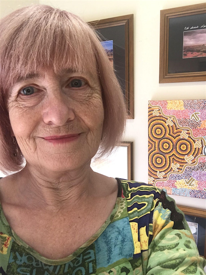 Head and Shoulders image of a woman in front of artworks 