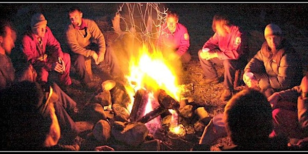 Men Sitting by a Fire