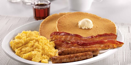 Breakfast of bacon, eggs and pancakes