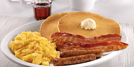 Breakfast of bacon, eggs and pancakes