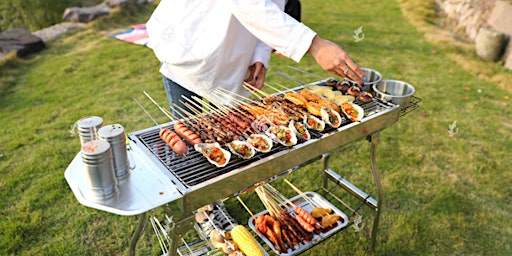 Young people barbecuing outdoors