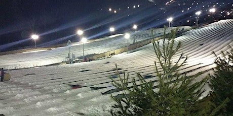 Snow Tubing Under a Full Moon with Transportation