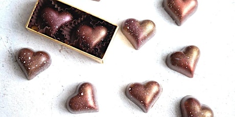 Breakable chocolate heart with sweet treats