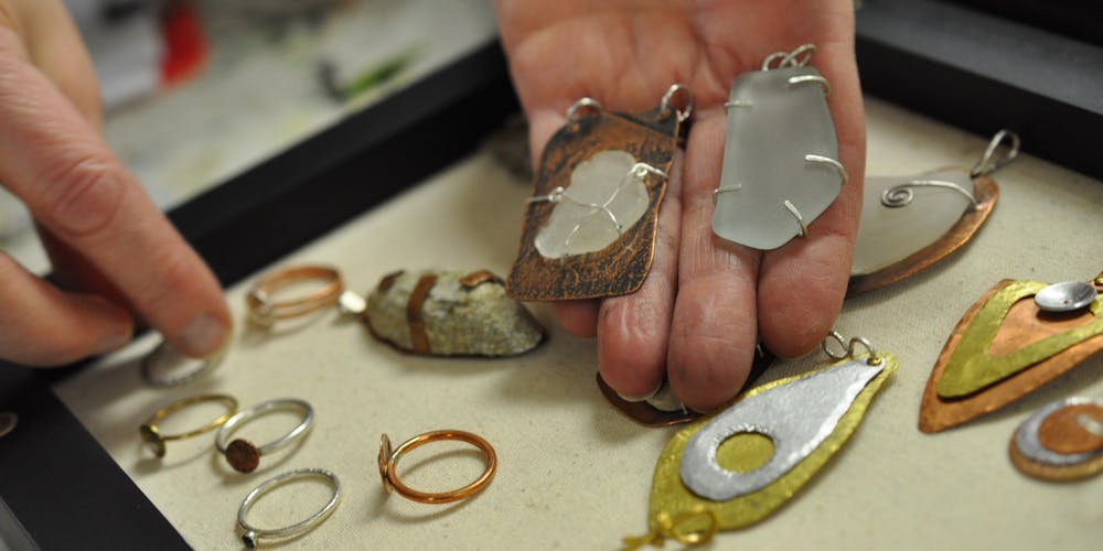 hands showing mandmade jewellry
