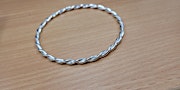 TWISTED SILVER BANGLE primary image